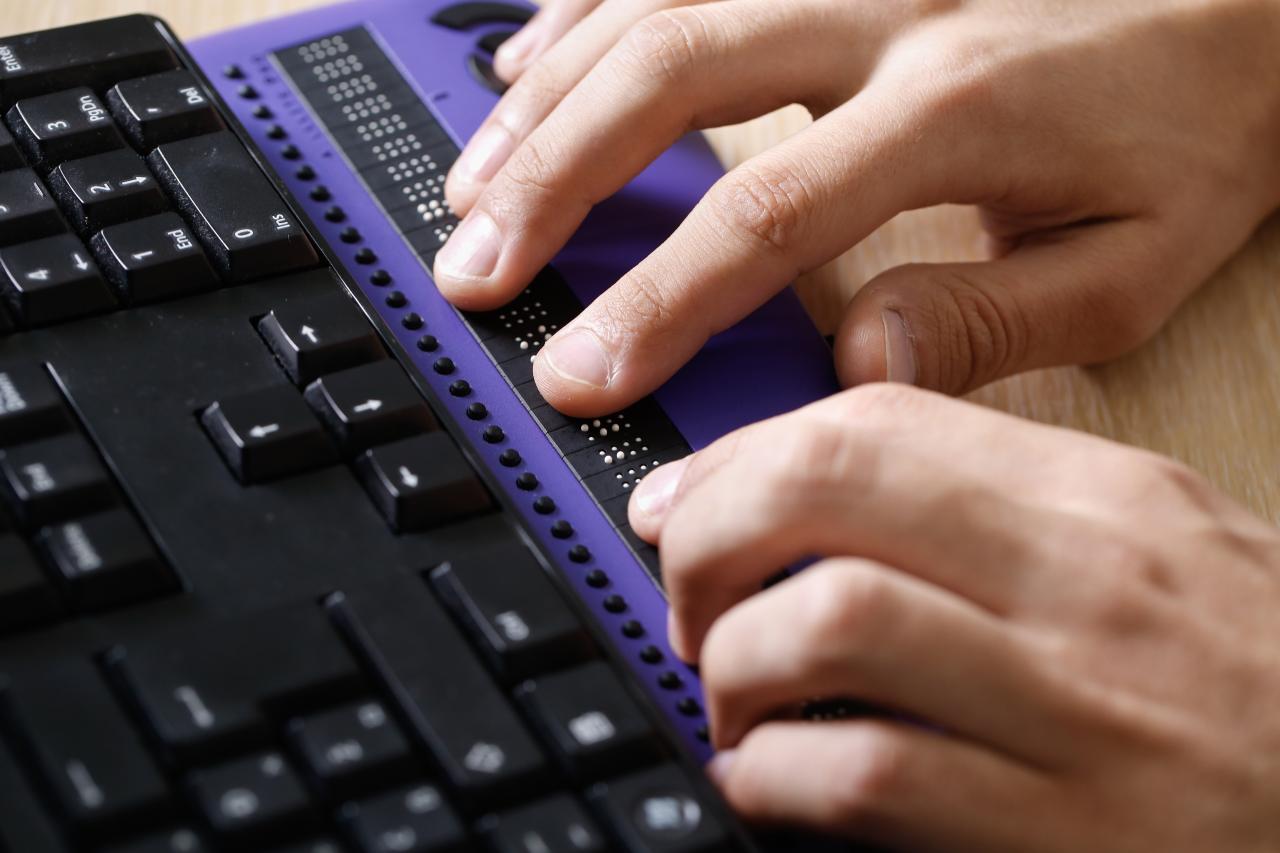 image of someone using a braille note keyboard.