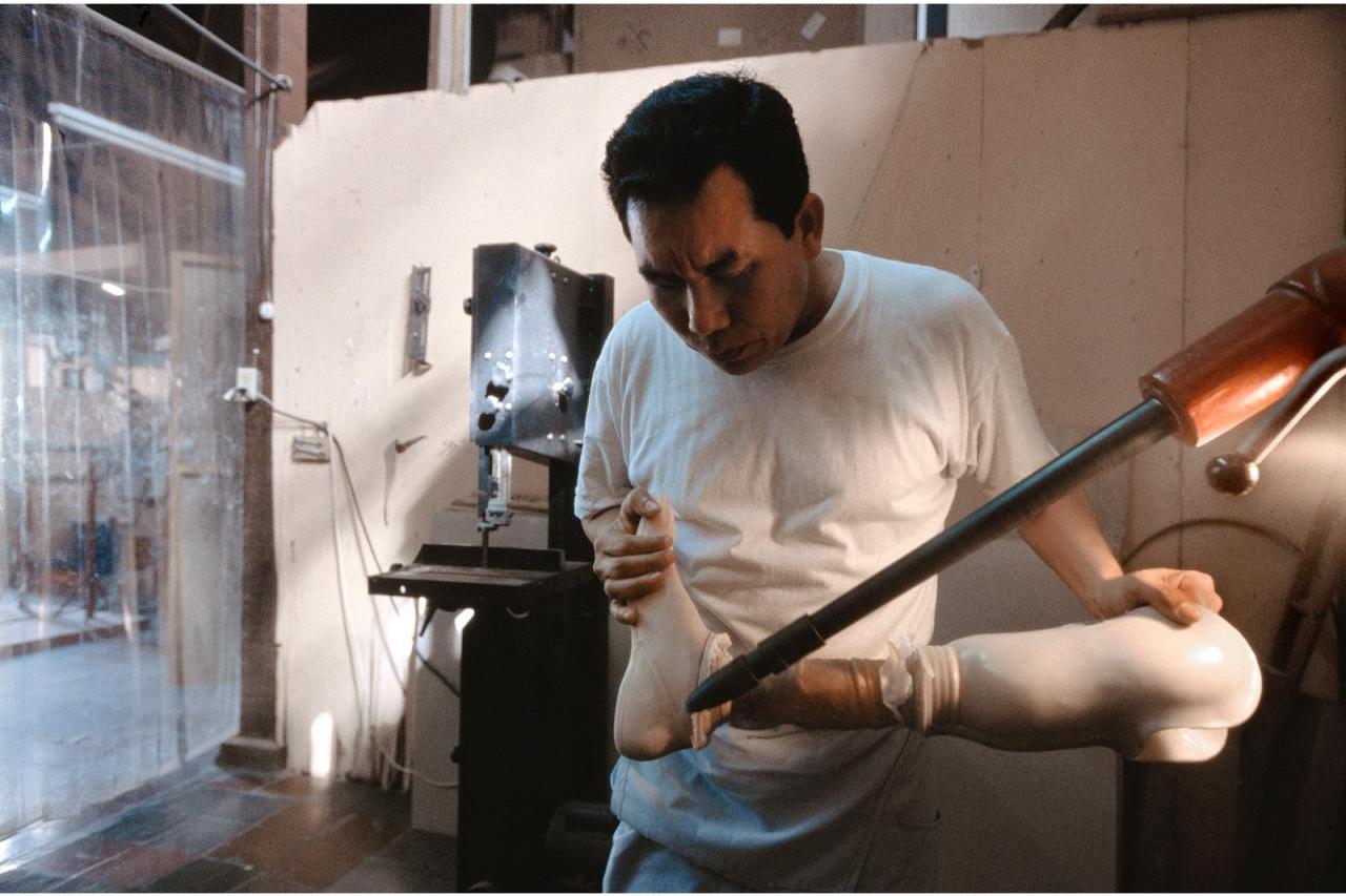 Man building a prosthetic leg (photo by Stephen Petegorsky)